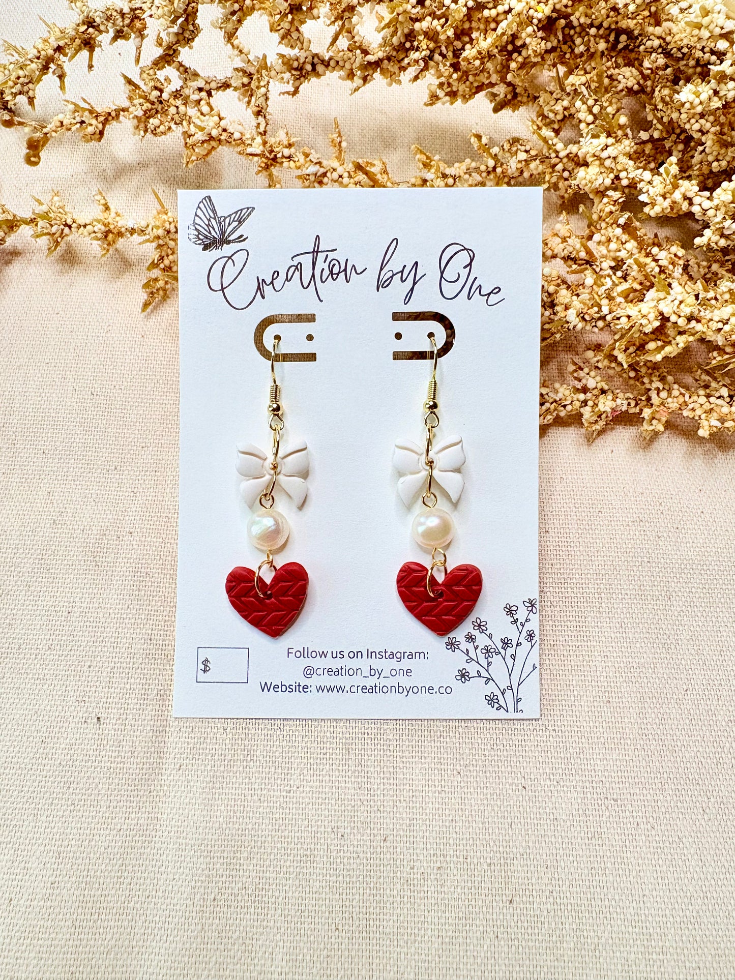 Romantic gold plated heart earrings with bow and pearl detail lightweight statement jewelry