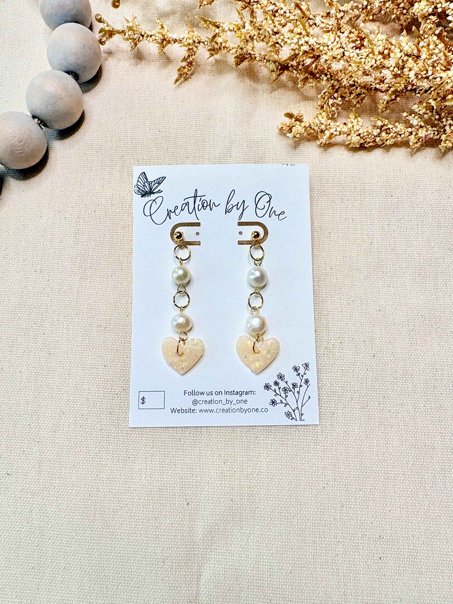 Elegant gold plated stud earrings with letter design pearls and translucent heart