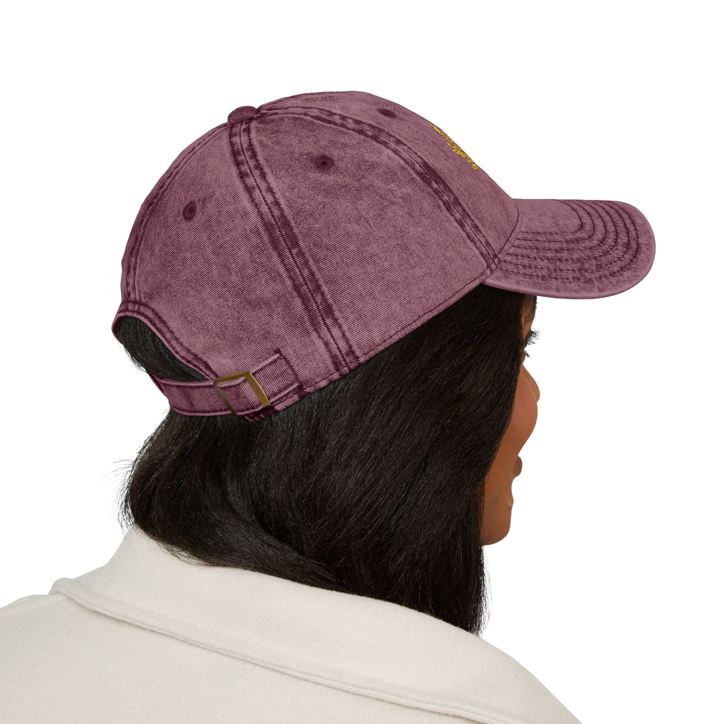 A Lady wearing a maroon color hat