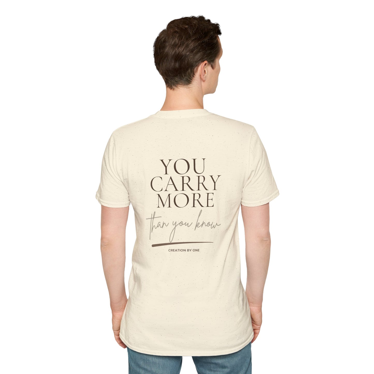 Person wearing a cream t-shirt with text on the back, standing against a white background