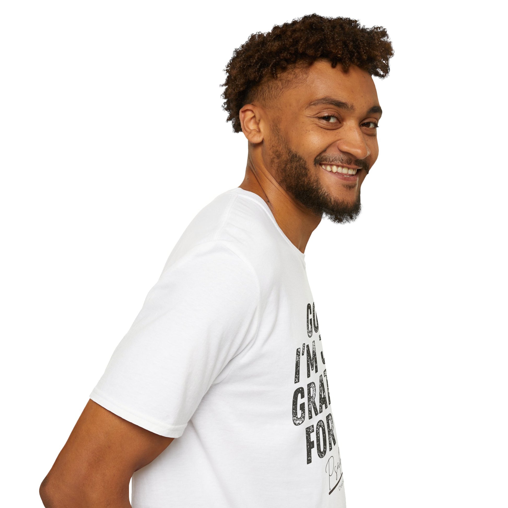 Man wearing a white t-shirt with a colorful graphic design on a white background