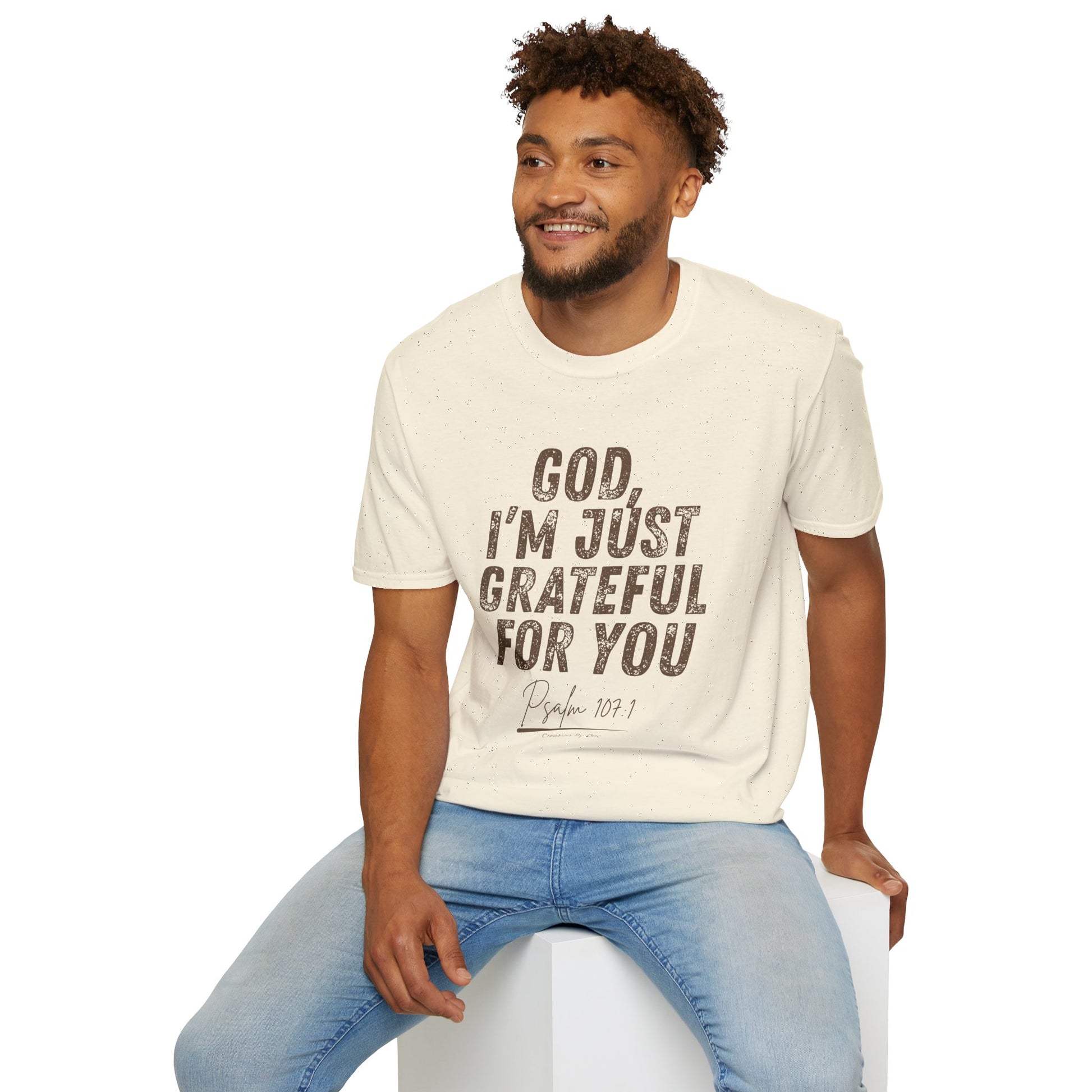 Man wearing a cream t-shirt with 'Travel is better with you' graphic design.