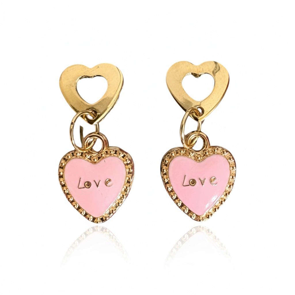 Heart-shaped earrings with pink centers and gold frames on a white background