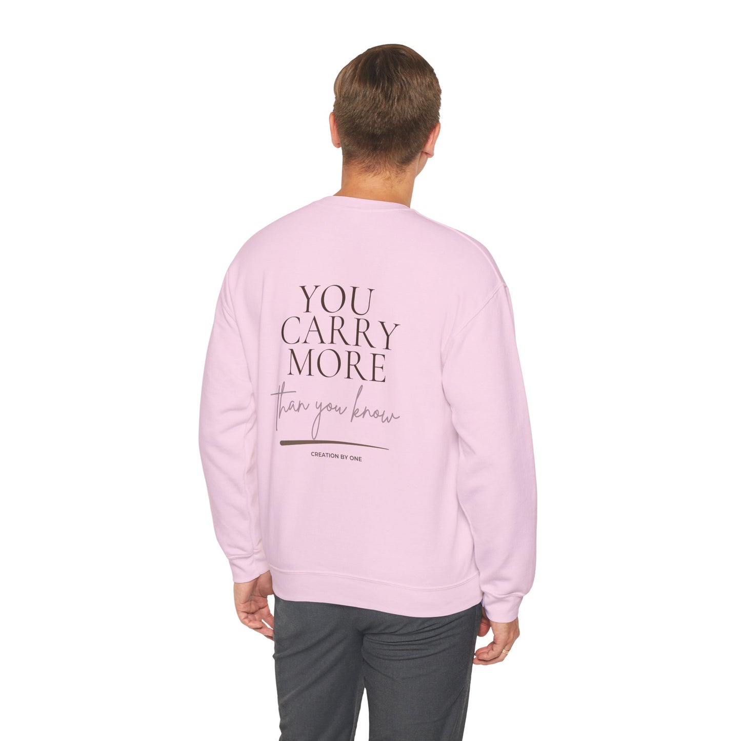 Person wearing a pink sweatshirt with 'Print it your way' text on the back, on a white background