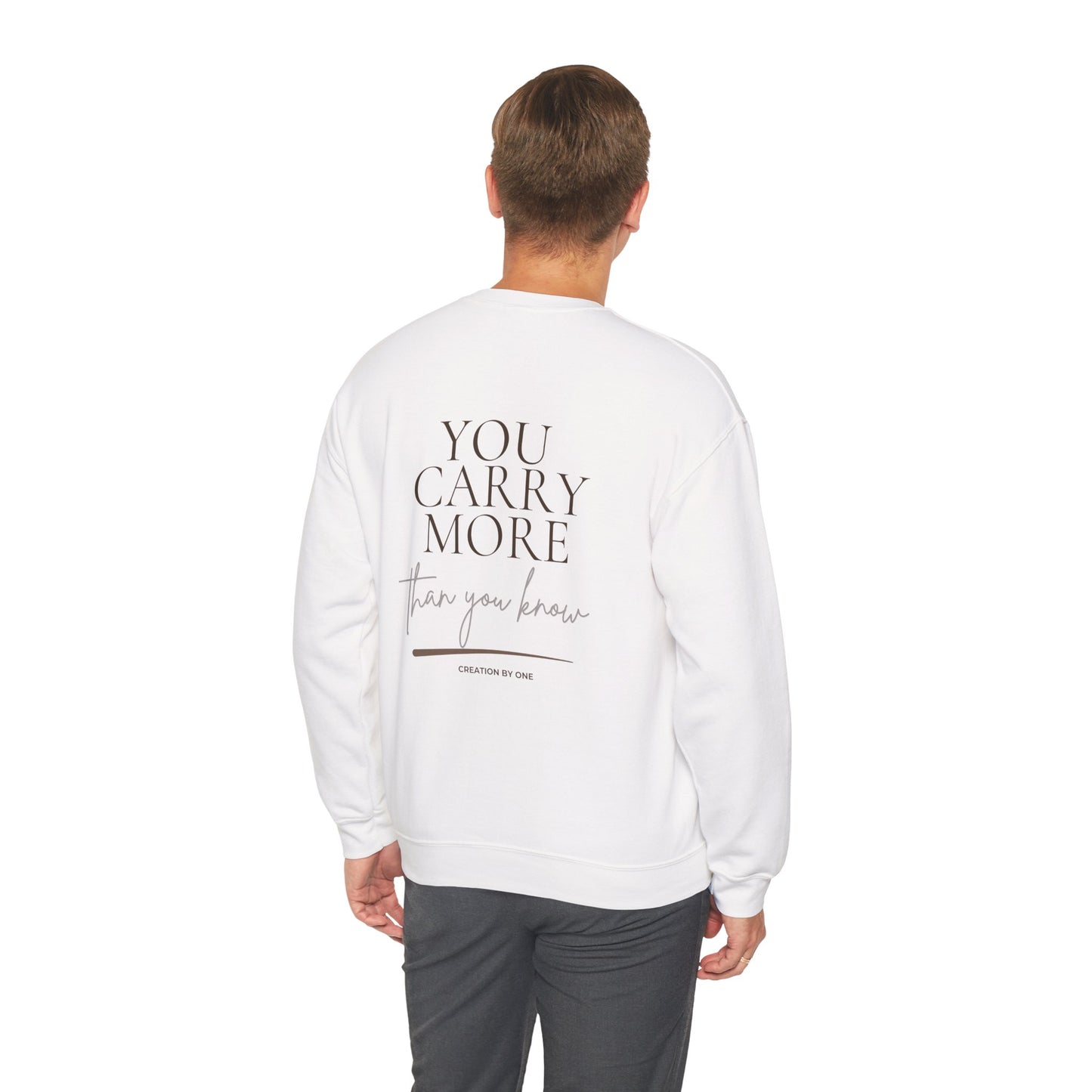 Person wearing a white sweatshirt with 'You Carry More than you know' text on the back, standing against a white background