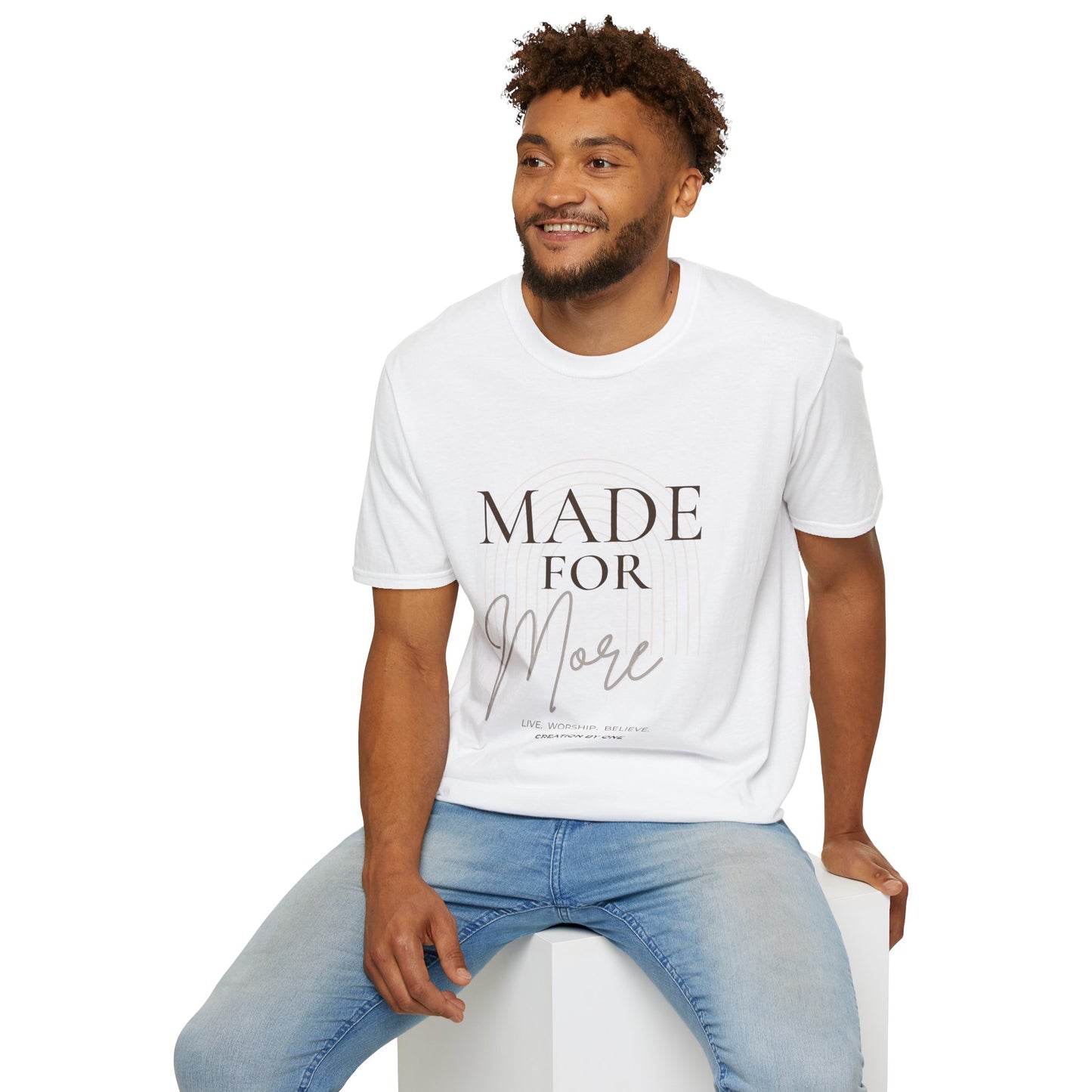 Man wearing a white t-shirt with 'Est. 2026' text and graphic, sitting on a white stool against a white background.