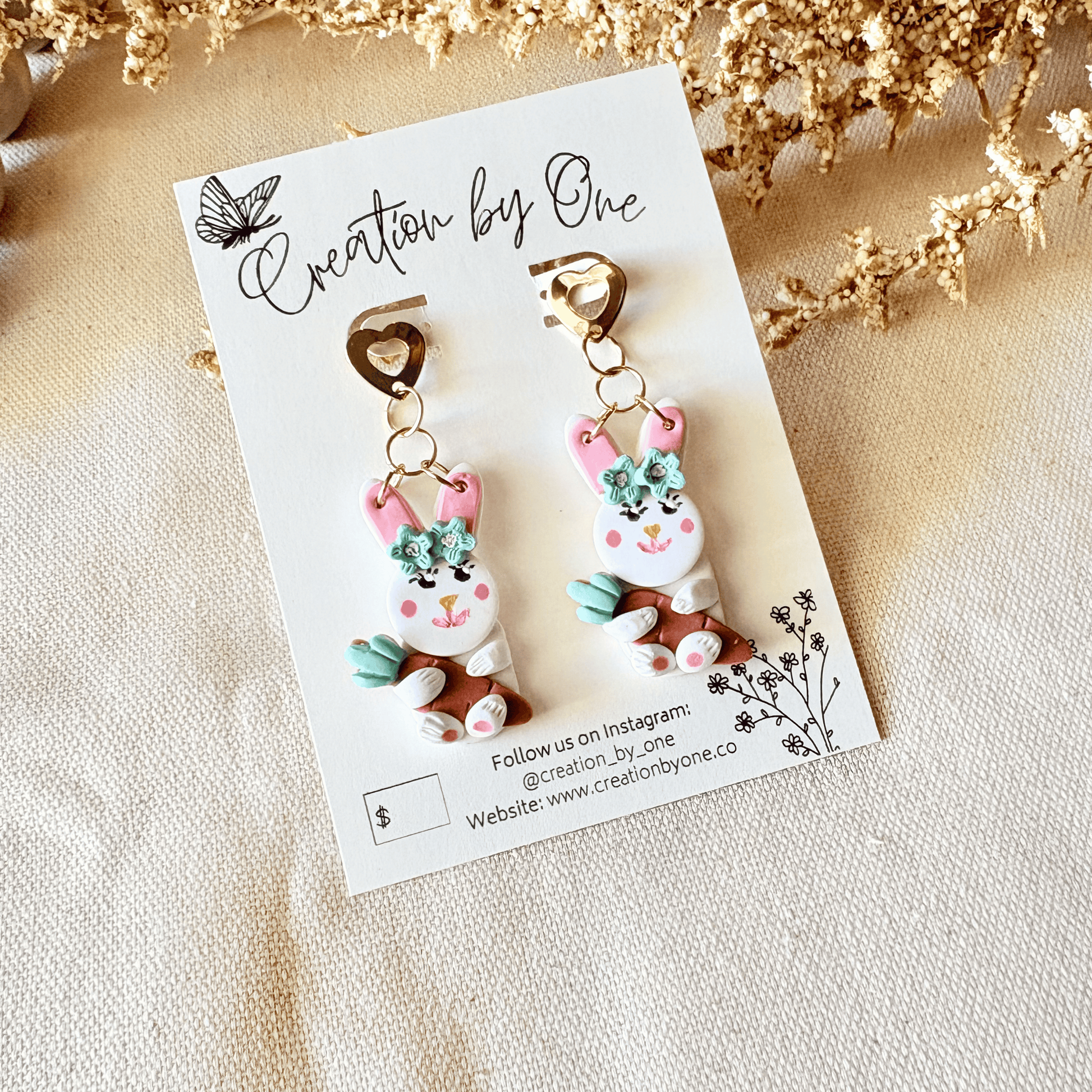 Handmade Easter bunny earrings holding a carrot with 14K gold-plated heart-shaped stud