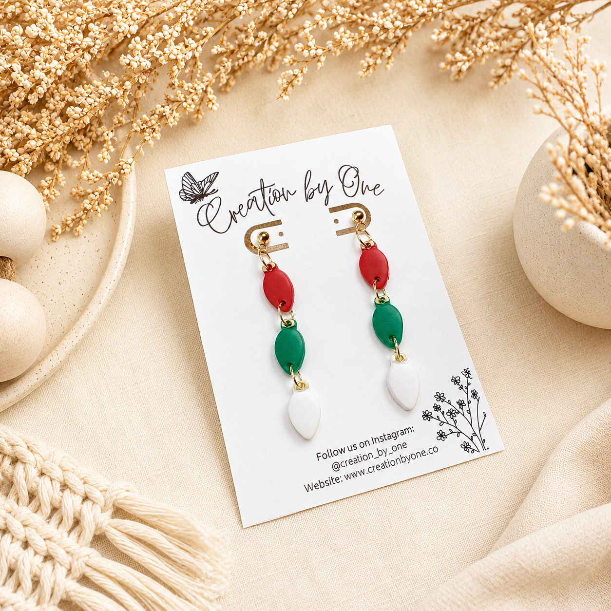 Handmade polymer clay Christmas light bulb stud earrings in red, green, and white with 14K gold-plated posts