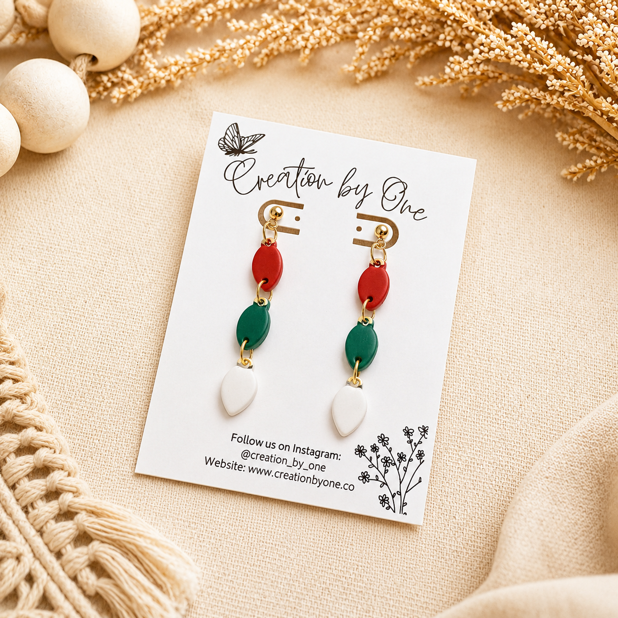 Handmade polymer clay Christmas light bulb stud earrings in red, green, and white with 14K gold-plated posts
