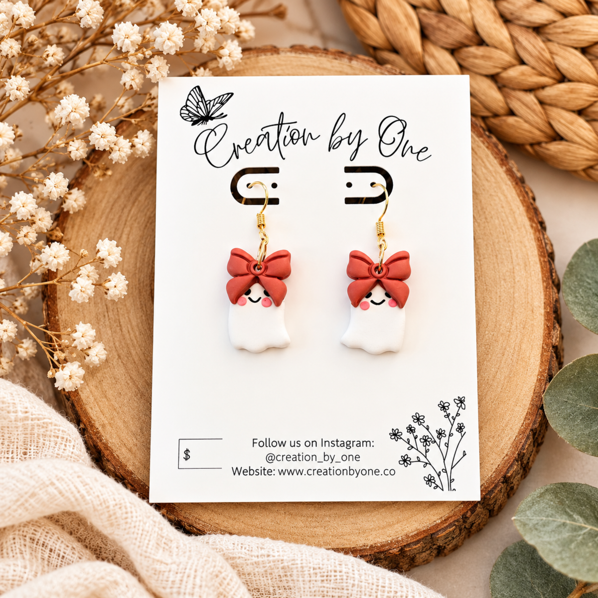 Cute white ghost earrings with bows and gold-tone hooks