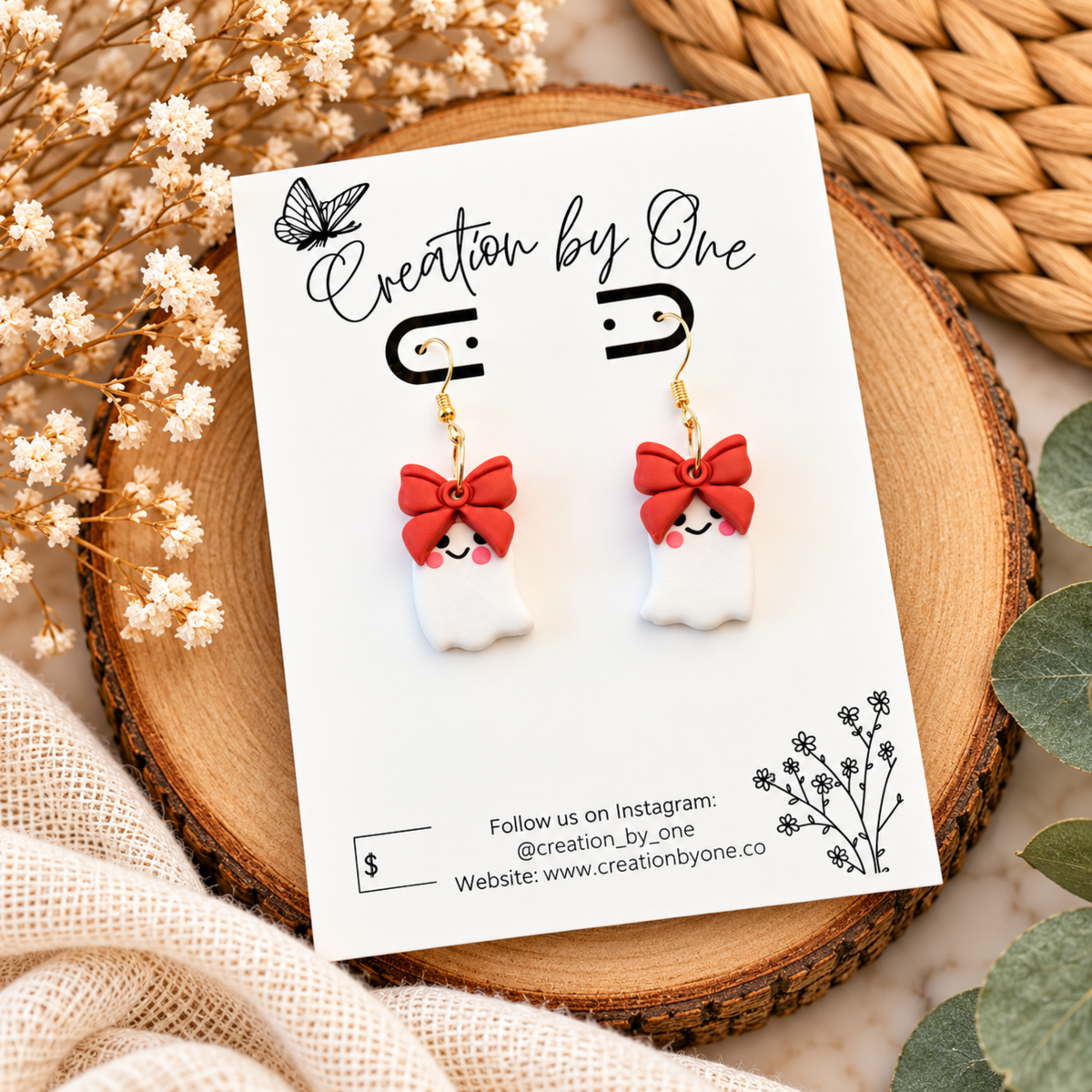 Cute white ghost earrings with bows and gold-tone hooks