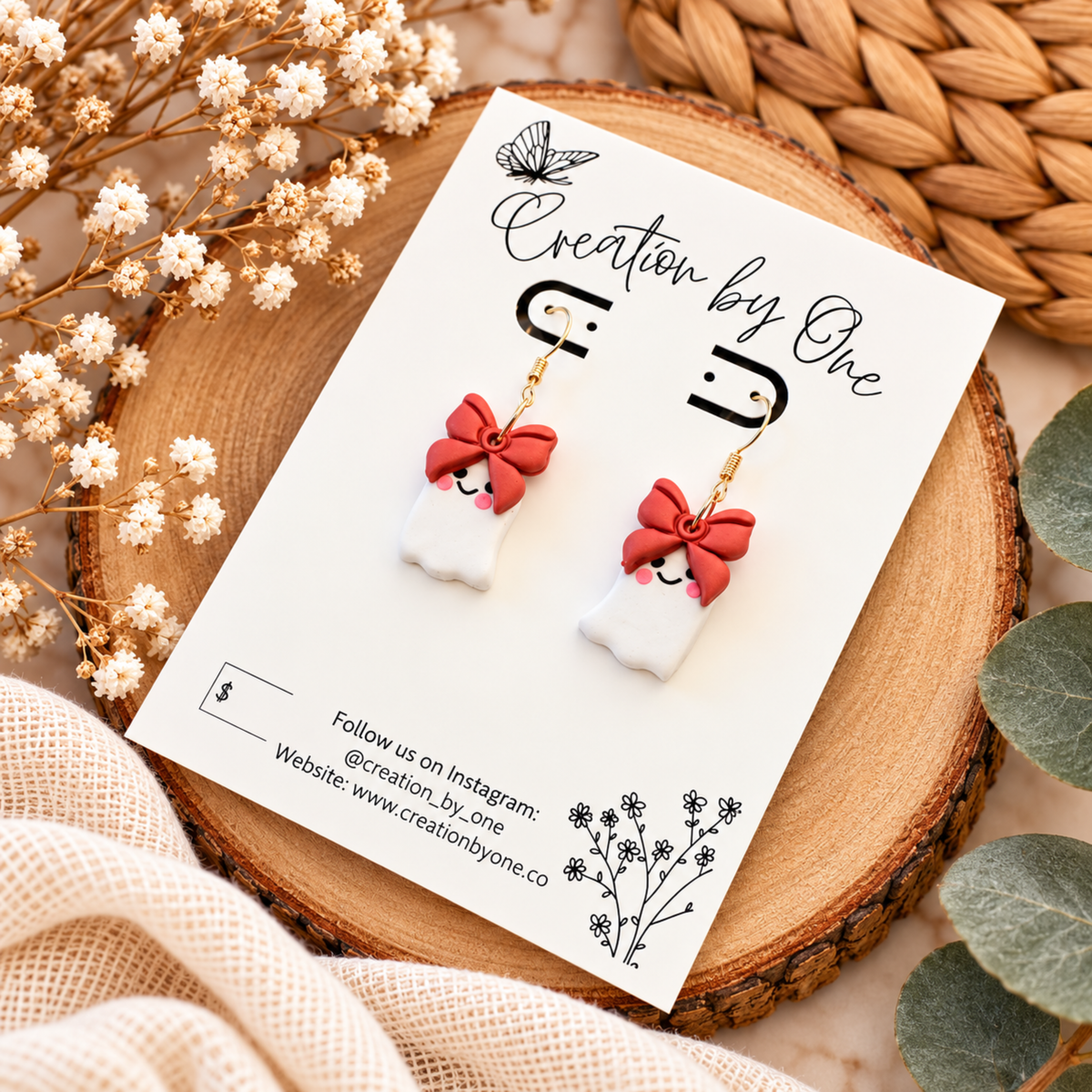 Cute white ghost earrings with bows and gold-tone hooks