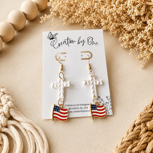 Earrings with American flag design on a branded card with decorative elements.