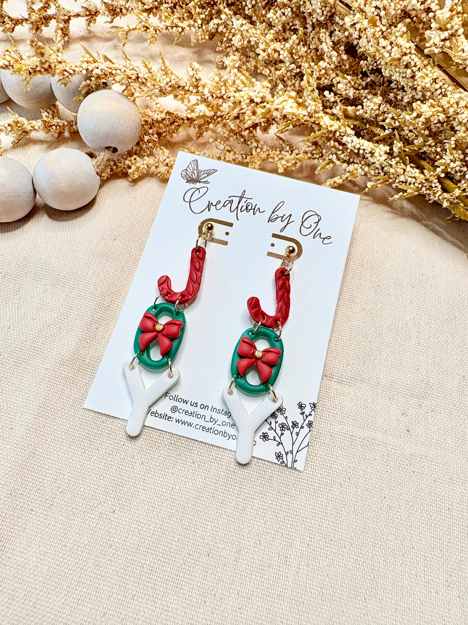 Festive Joy holiday earrings made from polymer clay with gold-plated studs