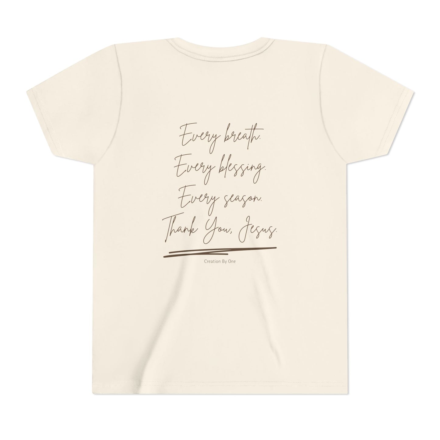 Beige t-shirt with text 'Every breath, Every blessing, Every season, Thank You Jesus' on a white background