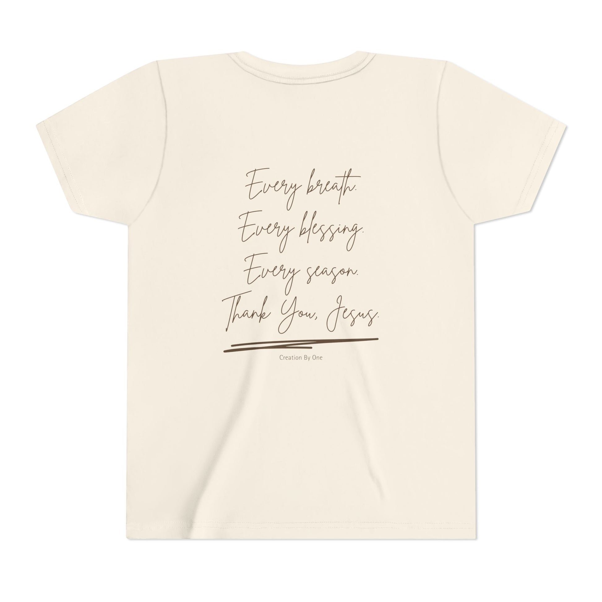 Beige t-shirt with text 'Every breath, Every blessing, Every season, Thank You Jesus' on a white background