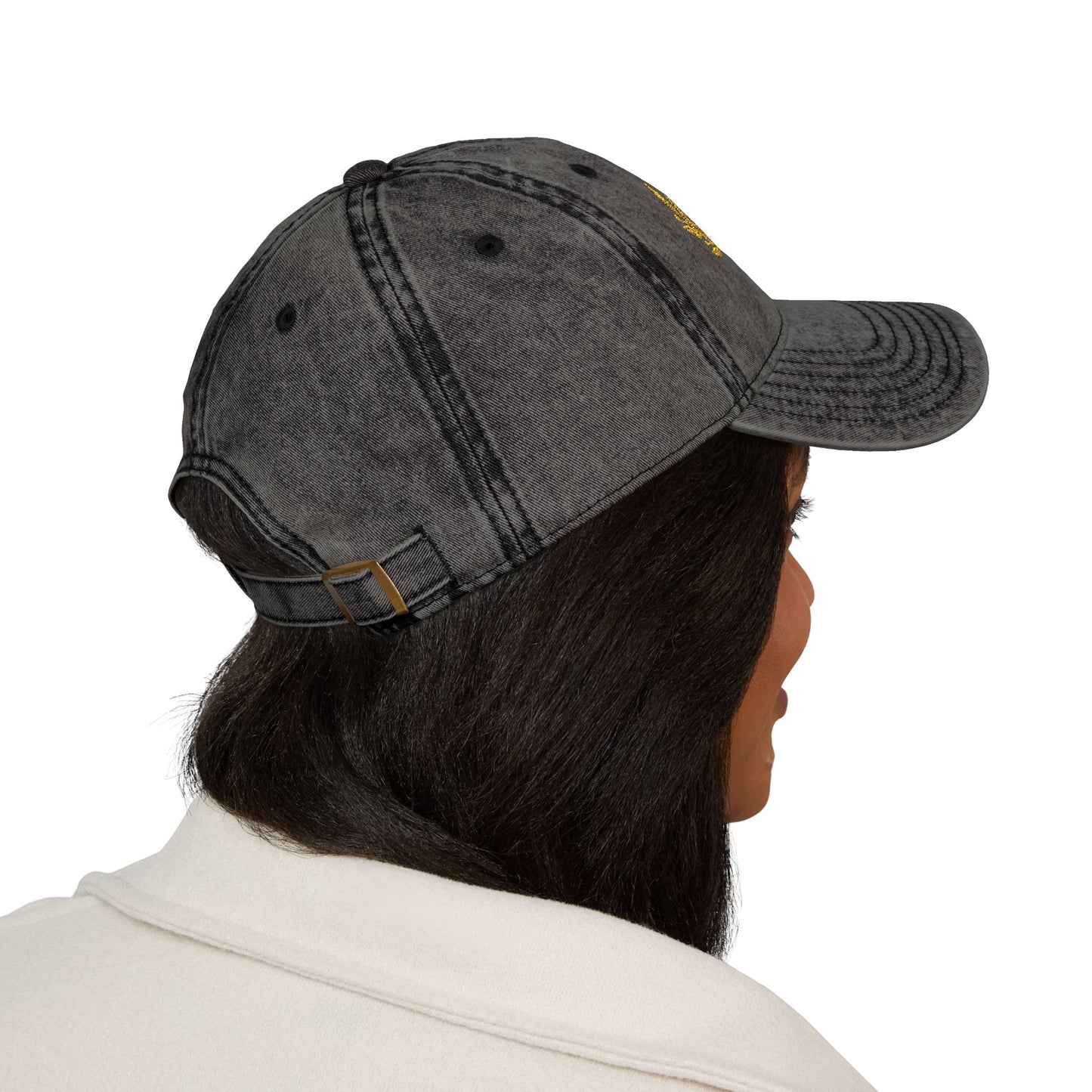 A lady wearing a black hat