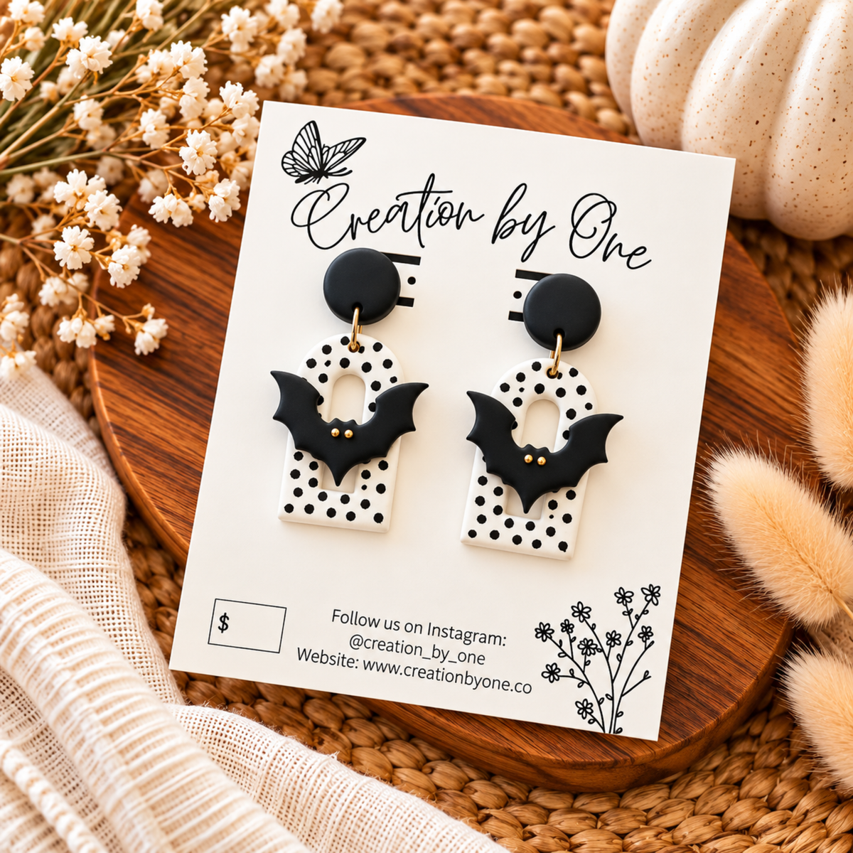 Black bat polymer clay earrings with white polka dot arches and black studs