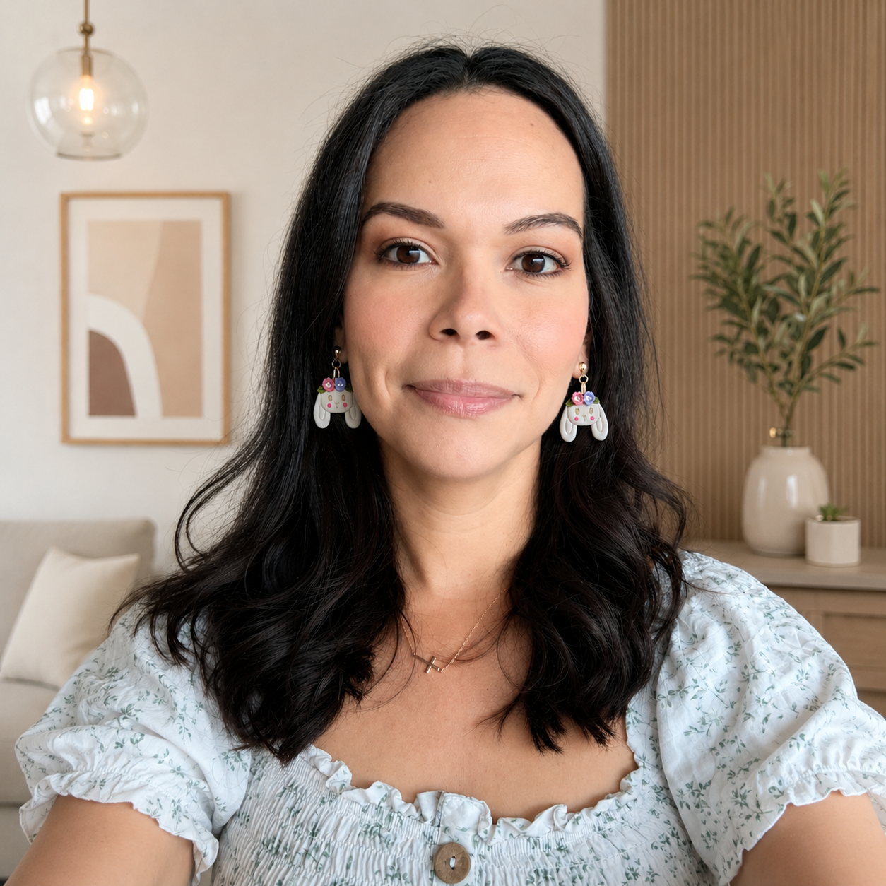 Woman wearing earrings in a home setting