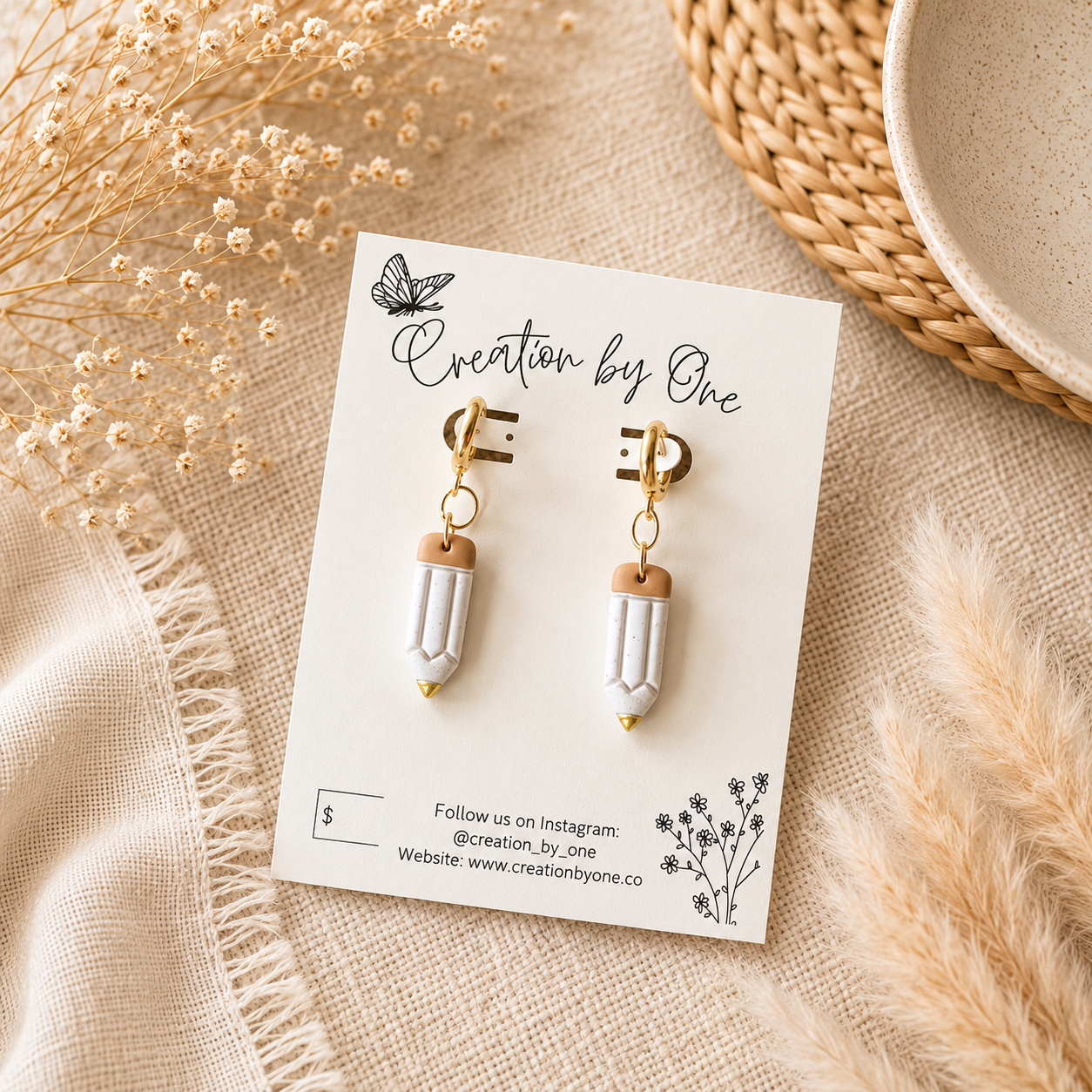 Handmade polymer clay teacher pencil earrings with gold accents displayed on a Creation by One jewelry card. Lightweight teacher gift perfect for classrooms and everyday wear.