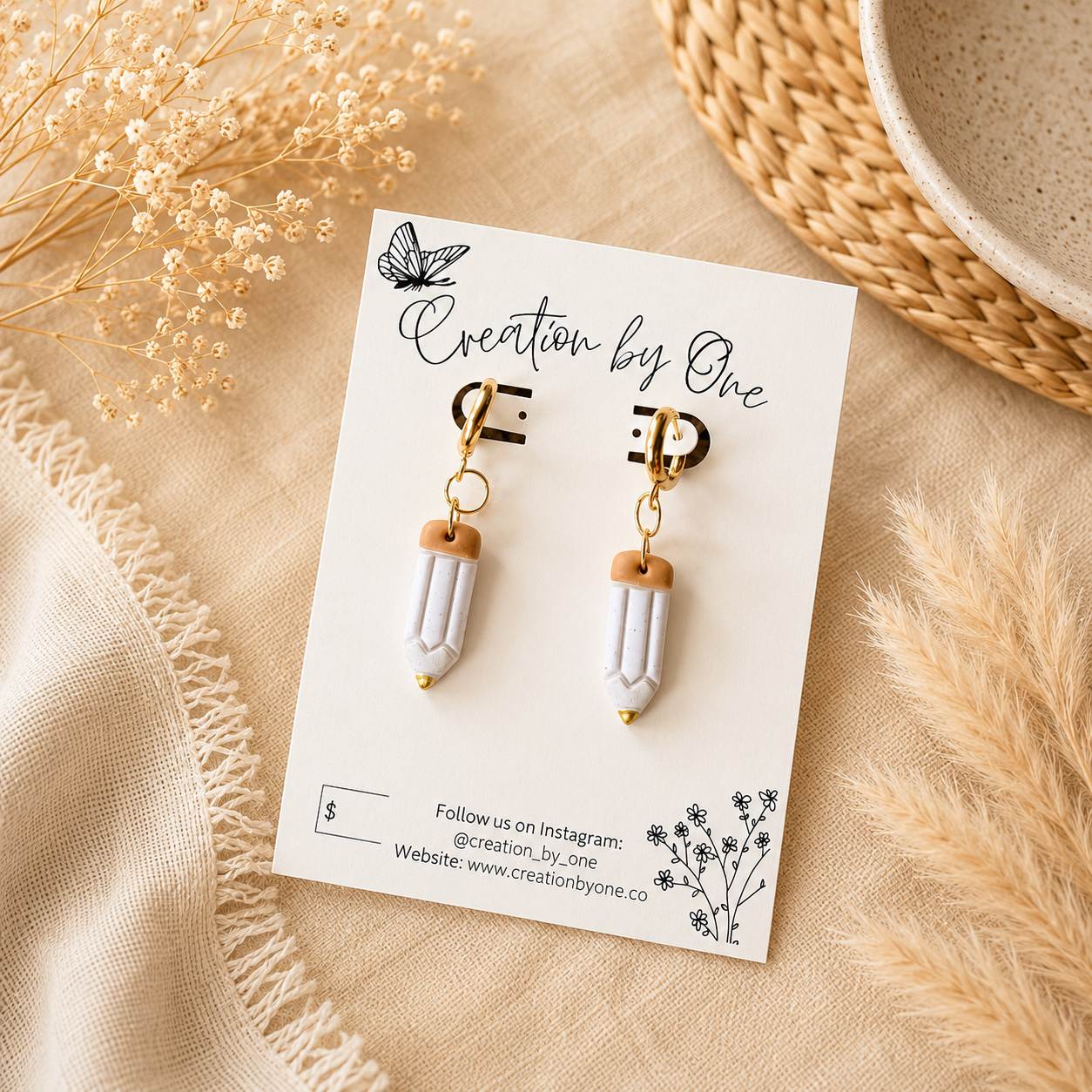 Handmade polymer clay teacher pencil earrings with gold accents displayed on a Creation by One jewelry card. Lightweight teacher gift perfect for classrooms and everyday wear.