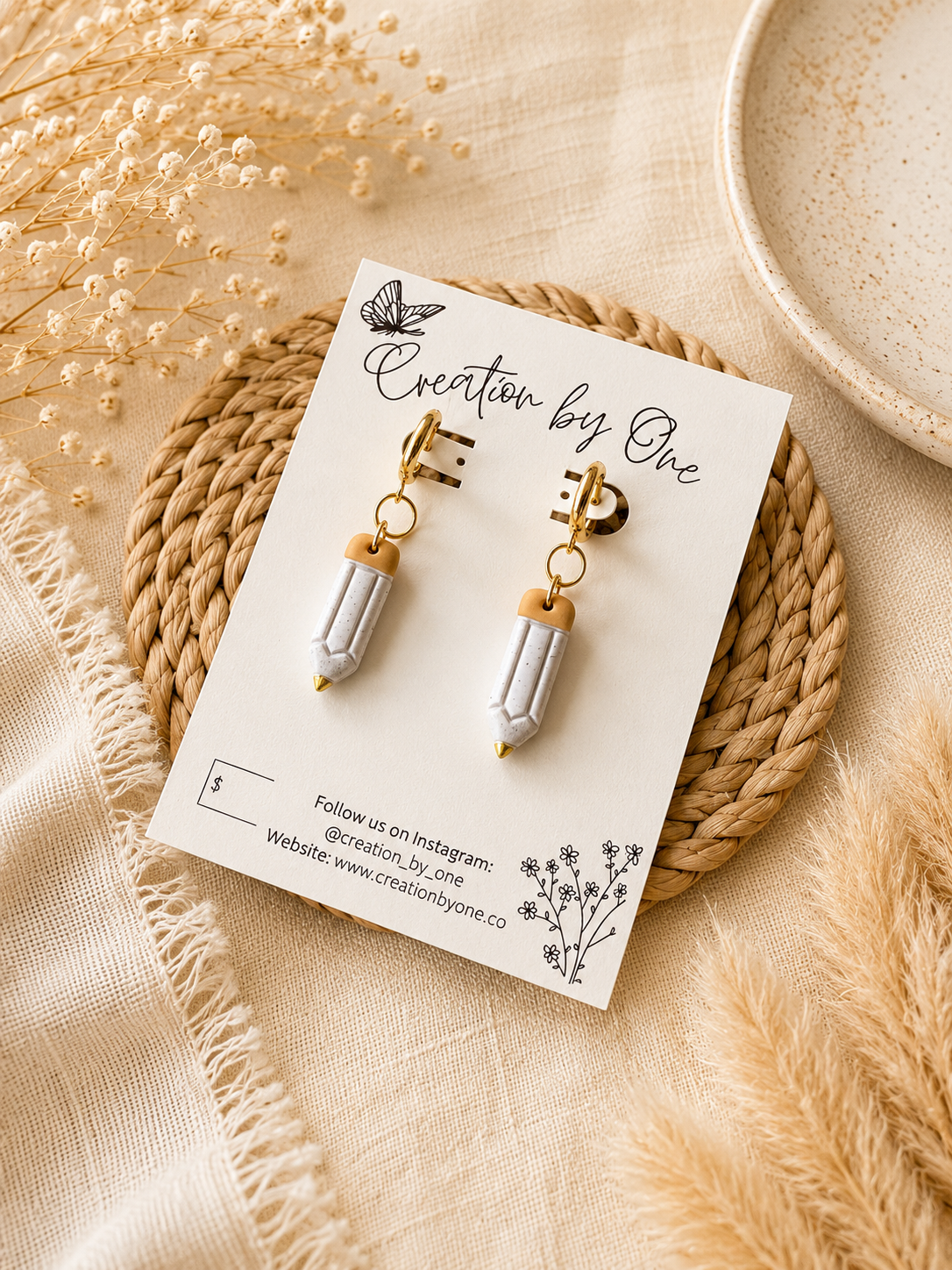 Handmade polymer clay teacher pencil earrings with gold accents displayed on a Creation by One jewelry card. Lightweight teacher gift perfect for classrooms and everyday wear.