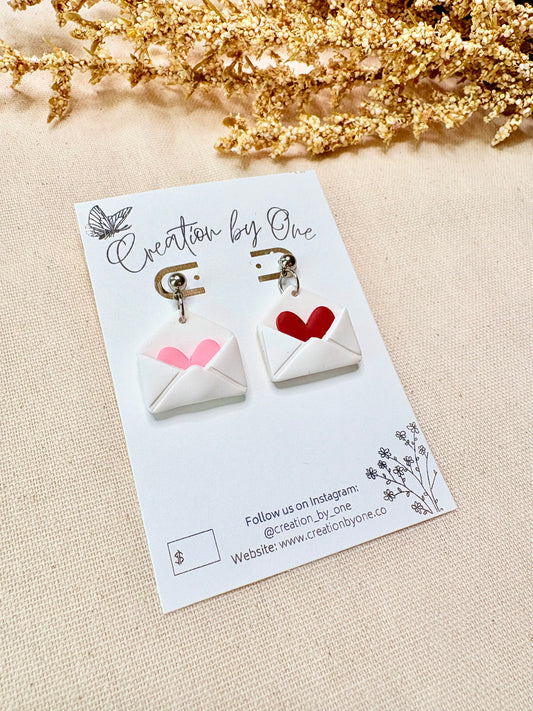 Love letter earrings with red and pink heart details and hypoallergenic studs by Creation by One