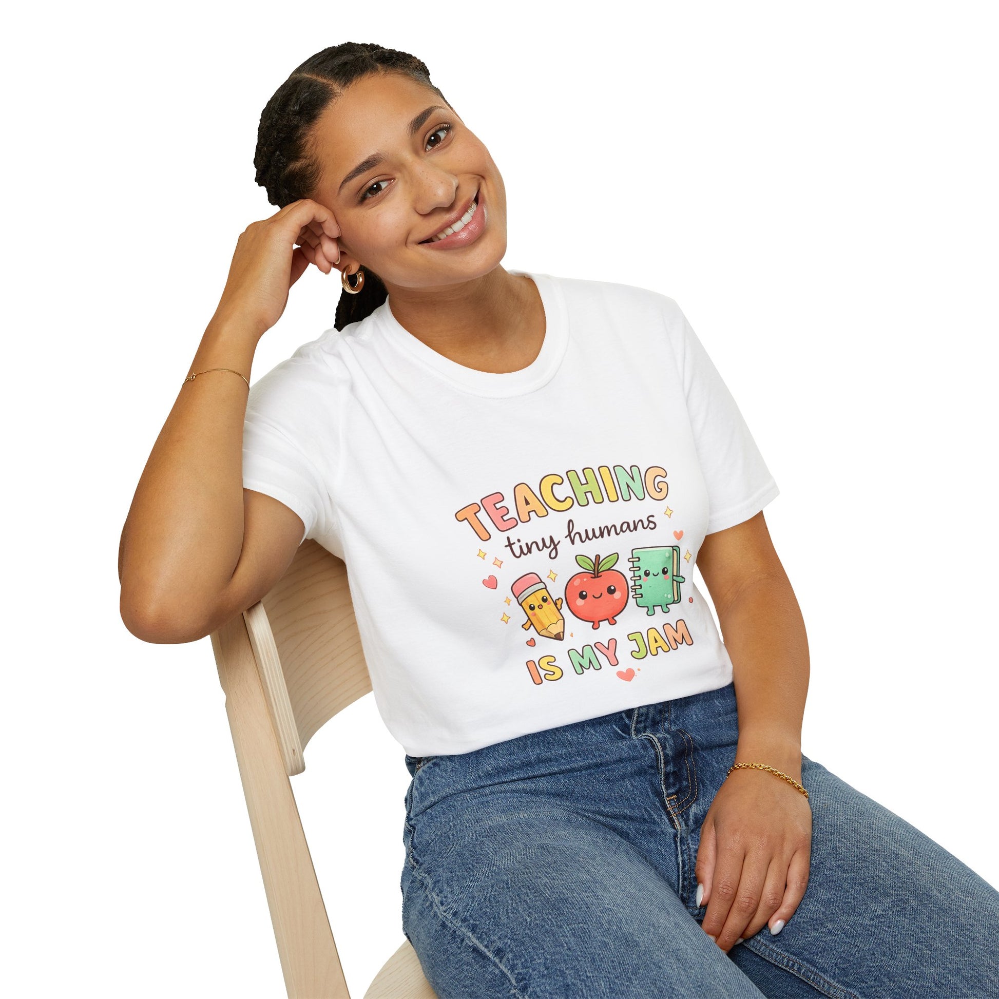 Woman wearing a white t-shirt with 'Country Mama' design, sitting on a chair.