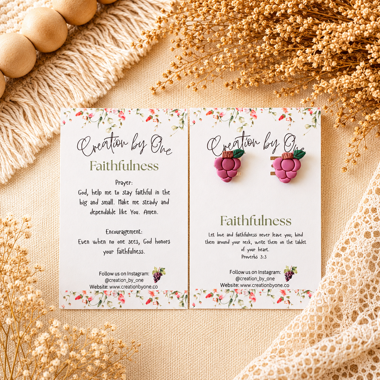 Earring card with earrings on a textured surface with dried flowers